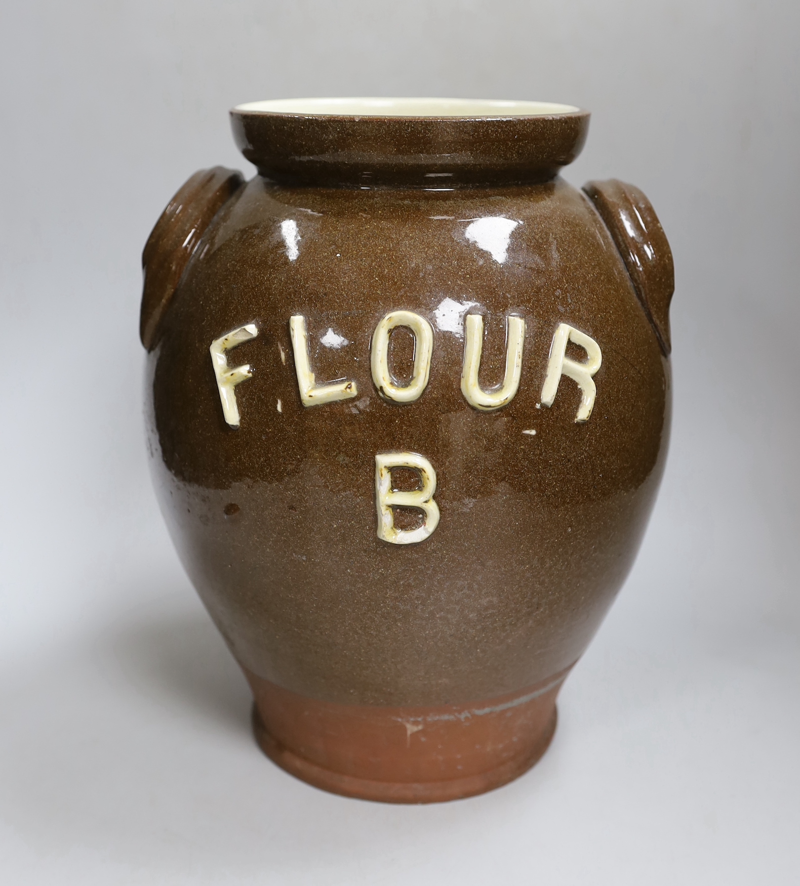 An early 20th century pottery jar inscribed ‘Flour B’, 30cm high